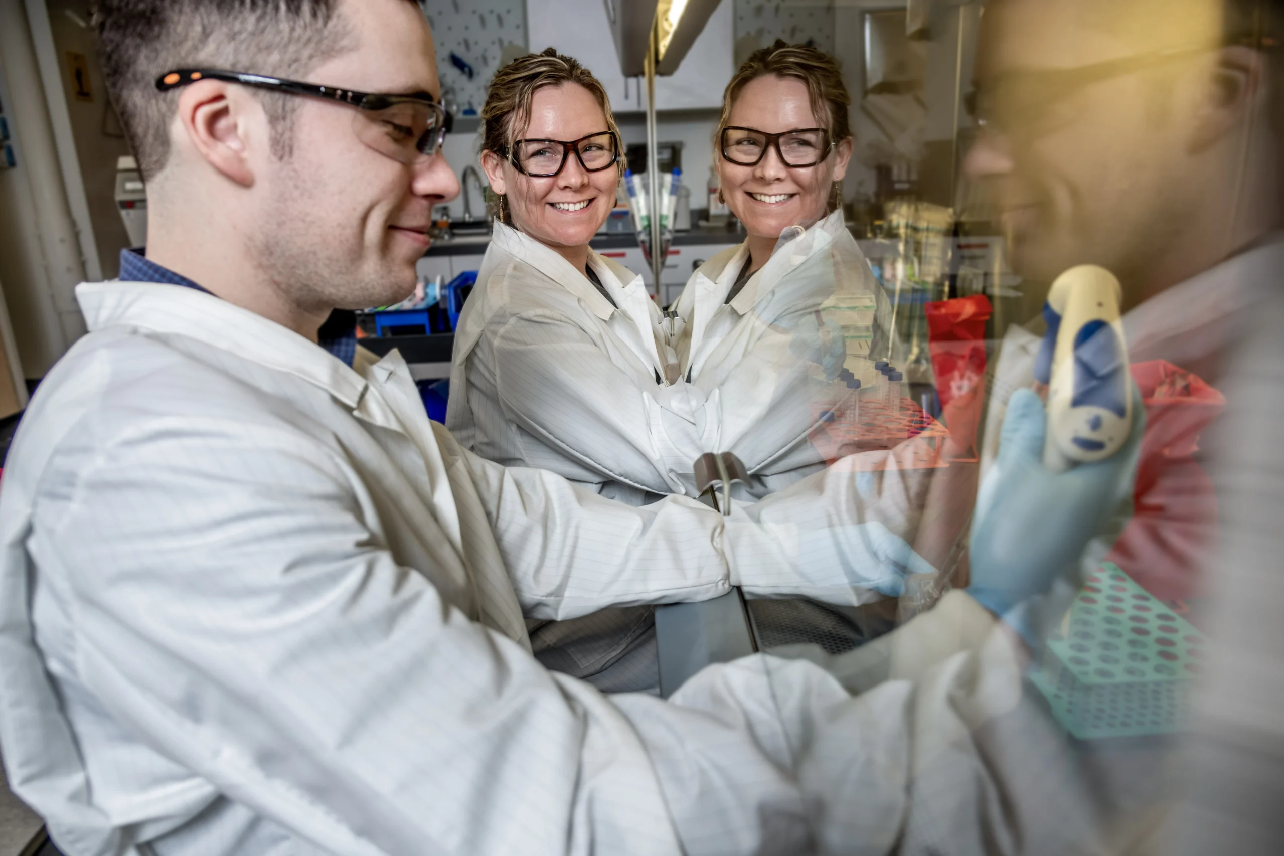 EpiVax lab associates performing an in vitro immunogenicity assay in our state-of-the-art lab in Providence, RI.